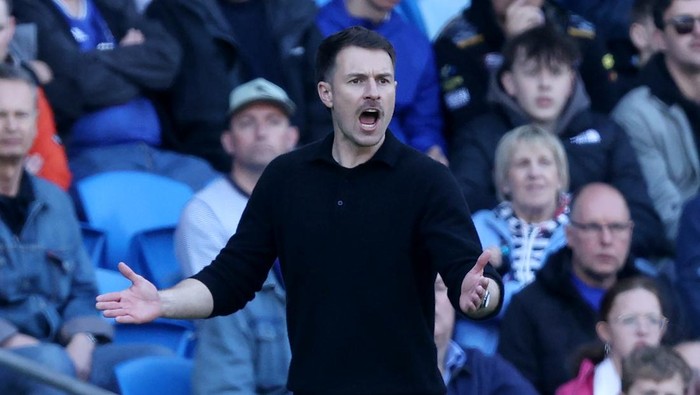 CARDIFF, WALES - APRIL 21: Aaron Ramsey, Interim Manager of Cardiff City, reacts during the Sky Bet Championship match between Cardiff City FC and Oxford United FC at Cardiff City Stadium on April 21, 2025 in Cardiff, Wales. (Photo by Ryan Hiscott/Getty Images)