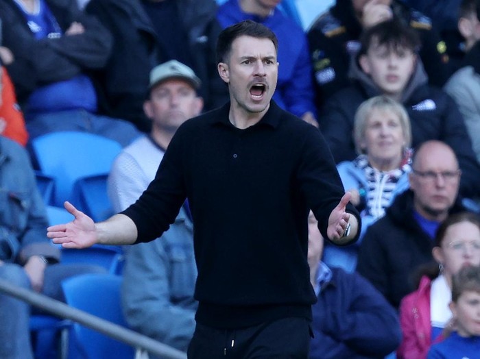 CARDIFF, WALES - APRIL 21: Aaron Ramsey, Interim Manager of Cardiff City, reacts during the Sky Bet Championship match between Cardiff City FC and Oxford United FC at Cardiff City Stadium on April 21, 2025 in Cardiff, Wales. (Photo by Ryan Hiscott/Getty Images)