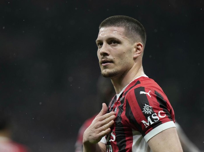 AC Milan's Luka Jovic reatcs after scoring during the Italian Cup semifinal second leg soccer match between Inter Milan and AC Milan at the San Siro stadium in Milan, Italy, Wednesday, April 23, 2025. (AP Photo/Luca Bruno)