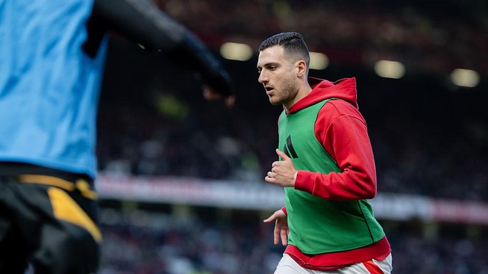 MANCHESTER, ENGLAND - APRIL 20: Diogo Dalot of Manchester United warms up during the Premier League match between Manchester United FC and Wolverhampton Wanderers FC at Old Trafford on April 20, 2025 in Manchester, England. (Photo by Ash Donelon/Manchester United via Getty Images)