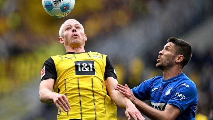Julian Ryerson SINSHEIM, GERMANY - APRIL 26: Julian Ryerson of Borussia Dortmund heads the ball under pressure from Andrej Kramaric of TSG 1899 Hoffenheim during the Bundesliga match between TSG 1899 Hoffenheim and Borussia Dortmund at PreZero-Arena on April 26, 2025 in Sinsheim, Germany. (Photo by Markus Gilliar/Getty Images)