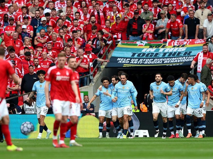 LONDON, ENGLAND - APRIL 27: Rico Lewis of Manchester City celebrates scoring his team's first goal with teammates during the Emirates FA Cup Semi Final match between Nottingham Forest and Manchester City at Wembley Stadium on April 27, 2025 in London, England. (Photo by Cameron Smith - The FA/The FA via Getty Images)