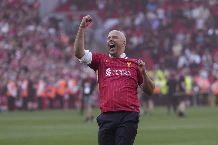 Liverpools manager Arne Slot celebrates after winning the English Premier League soccer match between Liverpool and Tottenham Hotspur and clinching the Premier League title at Anfield in Liverpool, England, Sunday, April 27, 2025. (AP Photo/Jon Super)