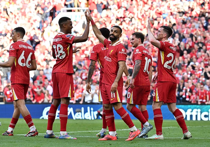 Liverpool LIVERPOOL, ENGLAND - APRIL 27: (SUN OUT, SUN ON SUNDAY OUT) Mohamed Salah of Liverpool celebrates scoring his teams fourth goal with teammate Ryan Gravenberch during the Premier League match between Liverpool FC and Tottenham Hotspur FC at Anfield on April 27, 2025 in Liverpool, England. (Photo by Liverpool FC/Liverpool FC via Getty Images)