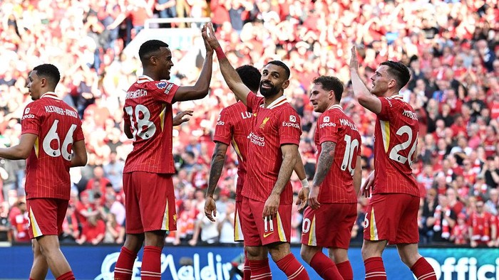 Liverpool LIVERPOOL, ENGLAND - APRIL 27: (SUN OUT, SUN ON SUNDAY OUT) Mohamed Salah of Liverpool celebrates scoring his teams fourth goal with teammate Ryan Gravenberch during the Premier League match between Liverpool FC and Tottenham Hotspur FC at Anfield on April 27, 2025 in Liverpool, England. (Photo by Liverpool FC/Liverpool FC via Getty Images)