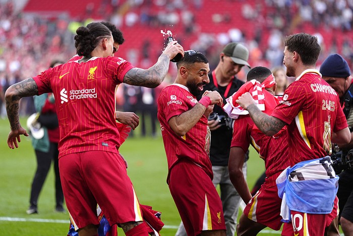 Mohamed Salah, Darwin Nunez Liverpools Mohamed Salah (centre) and team-mates celebrate victory and the Premier League title following the Premier League match at Anfield, Liverpool. Picture date: Sunday April 27, 2025. (Photo by Peter Byrne/PA Images via Getty Images)
