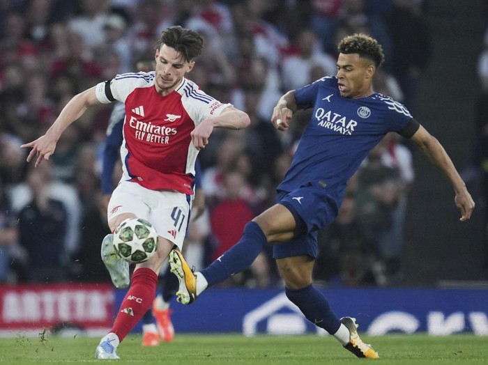 Declan Rice, Arseal, Paris Saint-Germain Arsenals Declan Rice vies for the ball with PSGs Desire Doue, right, during the Champions League semifinal first leg soccer match between Arsenal and Paris Saint-Germain at Arsenal Stadium in London, England, Tuesday, April 29, 2025. (AP Photo/Kin Cheung)
