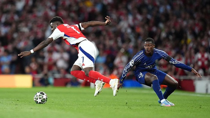 Nuno Mendes Arsenals Bukayo Saka (left) and Paris Saint Germains Nuno Mendes battle for the ball during the UEFA Champions League semi final, first leg match at the Emirates Stadium, London. Picture date: Tuesday April 29, 2025. (Photo by Adam Davy/PA Images via Getty Images)