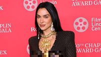 Gaya Seksi dan Berani Dua Lipa Berbalut Gaun Ular Transparan Schiaparelli