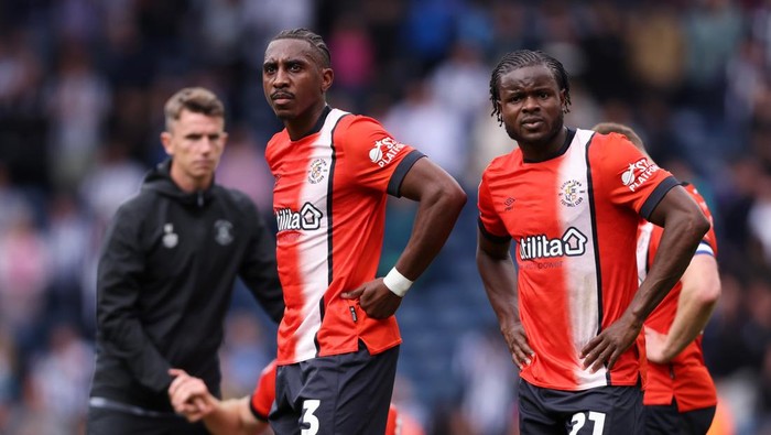 Luton Town WEST BROMWICH, ENGLAND - MAY 03: Amarii Bell and Millenic Alli of Luton Town look dejected after defeat confirmed the teams relegation to Sky Bet League One in the Sky Bet Championship match between West Bromwich Albion FC and Luton Town FC at The Hawthorns on May 03, 2025 in West Bromwich, England. (Photo by Paul Harding/Getty Images)