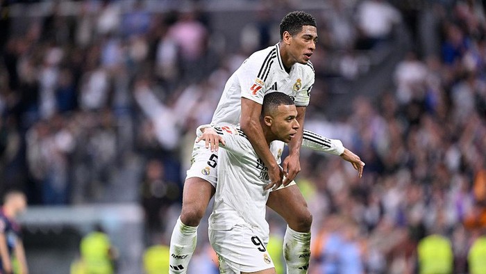 Kylian Mbappe centre-forward of Real Madrid and France celebrates with Jude Bellingham after scoring his sides first goal during the La Liga match between Real Madrid CF and RC Celta de Vigo at Estadio Santiago Bernabeu on May 4, 2025 in Madrid, Spain. (Photo by Jose Breton/Pics Action/NurPhoto via Getty Images)