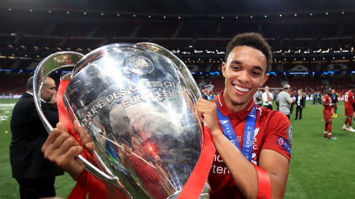  Trent Alexander-Arnold of Liverpool poses with the trophy during the UEFA Champions League Final between Tottenham Hotspur and Liverpool at Estadio Wanda Metropolitano on June 1, 2019 in Madrid, Spain. (Photo by Marc Atkins/Getty Images)