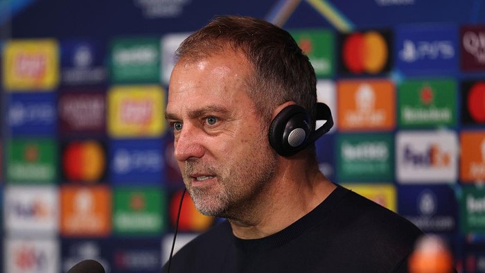 MILAN, ITALY - MAY 06: Hansi Flick, Head Coach of FC Barcelona, speaks to the media in a post match press conference following the teams defeat and subsequent elimination from the UEFA Champions League 2024/25 Semi Final Second Leg match between FC Internazionale Milano and FC Barcelona at Giuseppe Meazza Stadium on May 06, 2025 in Milan, Italy. (Photo by Ryan Pierse - UEFA/UEFA via Getty Images)