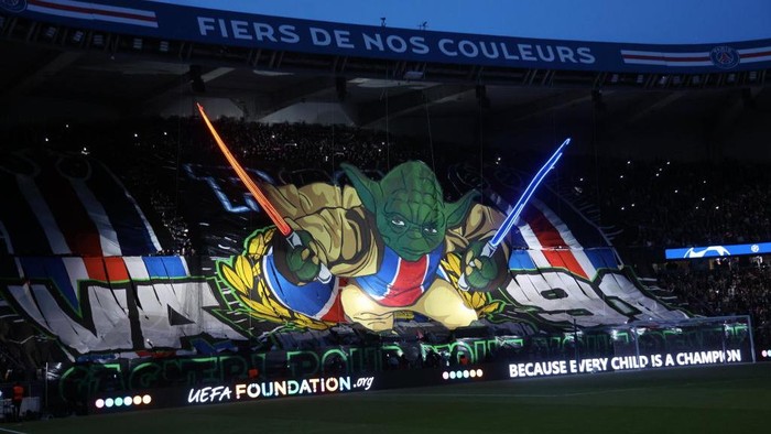 PSG Tifo PARIS, FRANCE - APRIL 10: Ultra fans of Paris Saint-Germain perform a tifo before the UEFA Champions League quarter-final first leg match between Paris Saint-Germain and FC Barcelona at Parc des Princes on April 10, 2024 in Paris, France. (Photo by Xavier Laine/Getty Images)