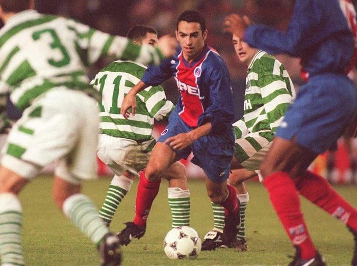 Paris Saint-Germain's Youri Djorkaeff (C) breaks through the Glasgow Celtic defense during their European Cup Winners Cup match in Paris 19 October. Paris Saint-Germain won 1-0 on a goal by Djorkaeff.
AFP PHOTO (Photo by VINCENT AMALVY / AFP)