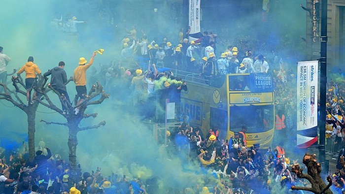 Fans line the street as the Leeds United parade buses enter the city centre during the Sky Bet Championship trophy parade in Leeds. Leeds United beat Burnley to the title on Saturday. Picture date: Monday May 5, 2025. (Photo by Owen Humphreys/PA Images via Getty Images)