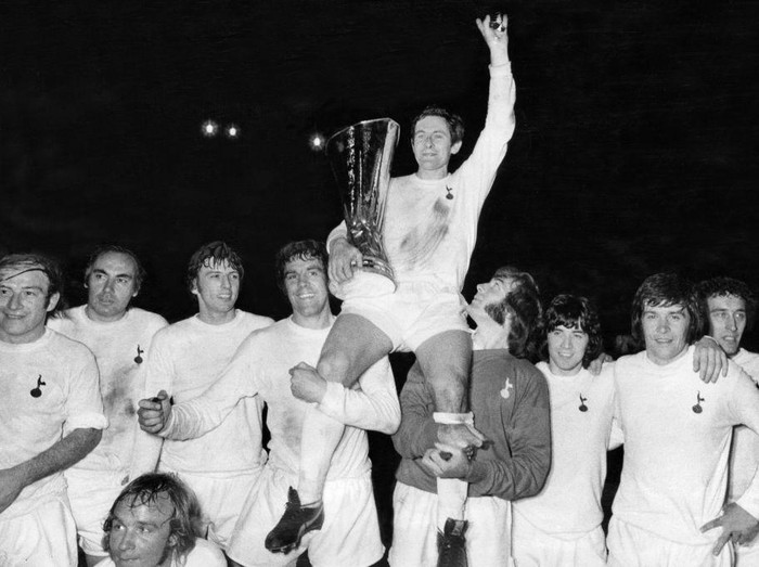 UEFA Cup Final Second Leg match at White Hart Lane. Tottenham Hotspur 1 v Wolverhampton Wanderers 1. (Spurs win 3-2 on aggregate score). Spurs captain Alan Mullery sits on the shoulders of his teammates as he proudly holds aloft the UEFA Cup trophy on a lap of honour after the match, 17th May 1972. (Photo by Monte Fresco/Mirrorpix/Getty Images)