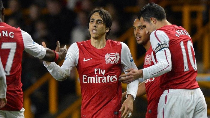 Yossi Benayoun Arsenal's Israeli midfielder Yossi Benayoun (2nd L) celebrates after scoring their third goal during the English Premier League football match between Wolverhampton Wanderers and Arsenal at Molineux Stadium in Wolverhampton, central England on April 11, 2012. AFP PHOTO/BEN STANSALL
RESTRICTED TO EDITORIAL USE. No use with unauthorized audio, video, data, fixture lists, club/league logos or live services. Online in-match use limited to 45 images, no video emulation. No use in betting, games or single club/league/player publications. (Photo by BEN STANSALL / AFP)