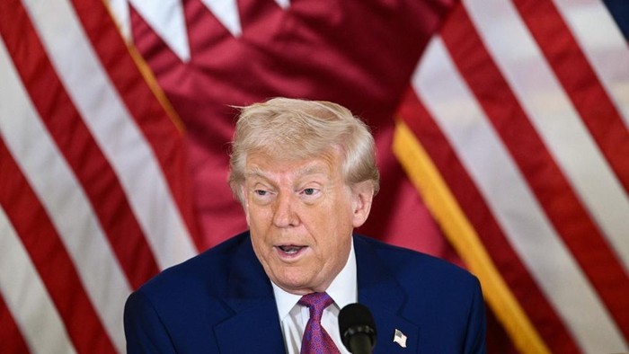 Presiden AS Donald Trump di saat berkunjung ke Doha, Qatar US President Donald Trump attends a breakfast with business leaders in Doha on May 15, 2025. (Photo by Brendan SMIALOWSKI / AFP)