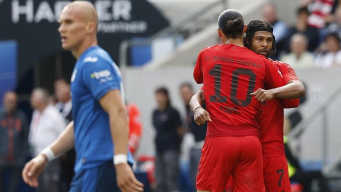 Soccer Football - Bundesliga - TSG 1899 Hoffenheim v Bayern Munich - PreZero Arena, Sinsheim, Germany - May 17, 2025  Bayern Munichs Serge Gnabry celebrates scoring their third goal with Bayern Munichs Leroy Sane REUTERS/Heiko Becker DFL REGULATIONS PROHIBIT ANY USE OF PHOTOGRAPHS AS IMAGE SEQUENCES AND/OR QUASI-VIDEO.
