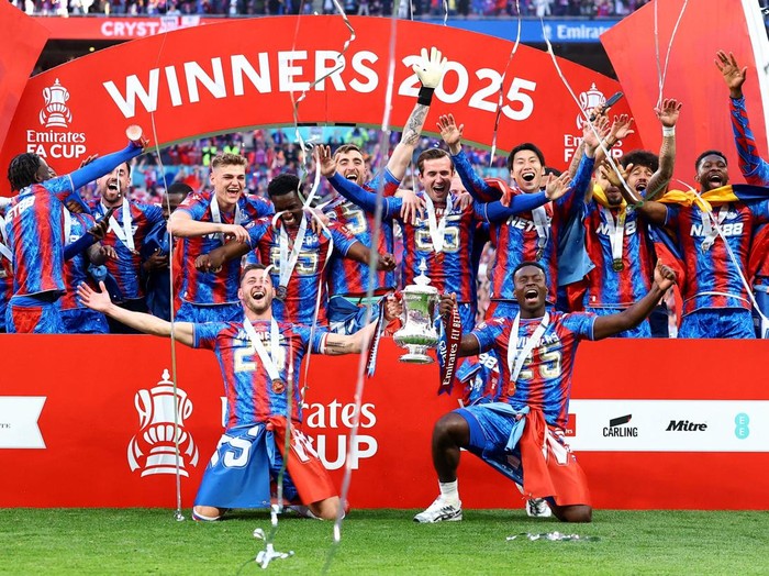 Soccer Football - FA Cup - Final - Crystal Palace v Manchester City - Wembley Stadium, London, Britain - May 17, 2025 Crystal Palace's Joel Ward and Marc Guehi with the trophy as they celebrate with teammates after winning the FA Cup Action Images via Reuters/Andrew Boyers