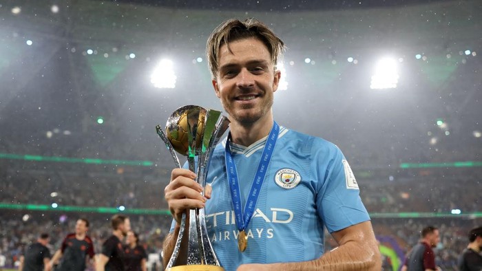 JEDDAH, SAUDI ARABIA - DECEMBER 22: Jack Grealish of Manchester City poses for a photograph with the FIFA Club World Cup trophy after their teams victory in the FIFA Club World Cup Saudi Arabia 2023 Final between Manchester City and Fluminense at King Abdullah Sports City on December 22, 2023 in Jeddah, Saudi Arabia. (Photo by Lars Baron - FIFA/FIFA via Getty Images)