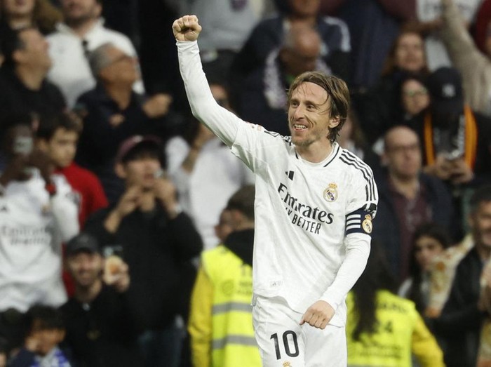 (FILES) Real Madrid's Croatian midfielder #10 Luka Modric celebrates scoring the opening goal during the Spanish league football match between Real Madrid CF and Girona FC at Santiago Bernabeu Stadium in Madrid on February 23, 2025. Real Madrid's Croatian midfielder Luka Modric said on May 22, 2025 he would leave the Spanish giants after the Club World Cup this summer. (Photo by Pierre-Philippe MARCOU / AFP)