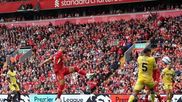 LIVERPOOL, ENGLAND - MAY 25: Mohamed Salah of Liverpool scores his team's first goal as Dean Henderson of Crystal Palace (not pictured) fails to make a save during the Premier League match between Liverpool FC and Crystal Palace FC at Anfield on May 25, 2025 in Liverpool, England. (Photo by Carl Recine/Getty Images)