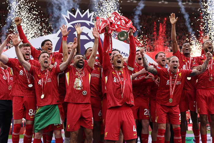 Liverpool LIVERPOOL, ENGLAND - MAY 25: Virgil van Dijk of Liverpool, lifts the Premier League trophy, as Liverpool are crowned the Champions of the Premier League, following the Premier League match between Liverpool FC and Crystal Palace FC at Anfield on May 25, 2025 in Liverpool, England. (Photo by Carl Recine/Getty Images)