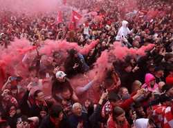 Gelar juara ini terasa lebih istimewa karena merupakan titel Liga Inggris ke-20, yang membawa Liverpool menyamai rekor juara Manchester United. (Foto: REUTERS/Phil Noble)