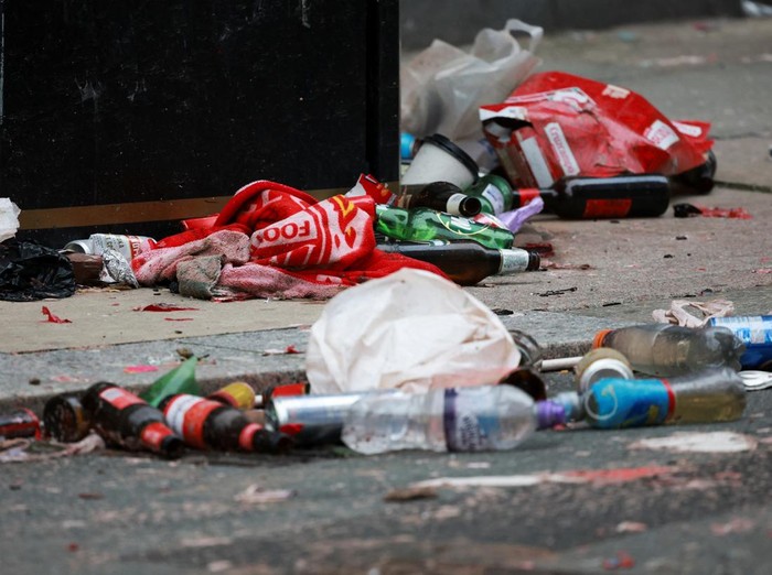 Forensic officers work near the site of an incident where a car plowed into a crowd of Liverpool fans during a parade celebrating their side's Premier League soccer title, in central Liverpool, Britain, May 27, 2025. REUTERS/Phil Noble
