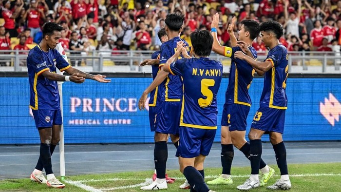 All-Stars Maung Maung Lwin (L) celebrates with teammates after scoring a goal during the exhibition friendly football match between Manchester United and Asean All-Stars at the National Stadium Bukit Jalil in Kuala Lumpur on May 28, 2025. (Photo by Mohd RASFAN / AFP)