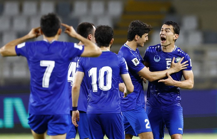 Soccer Football - World Cup - AFC Qualifiers - Group A - United Arab Emirates v Uzbekistan - Al Nahyan Stadium, Abu Dhabi, United Arab Emirates - June 5, 2025 Uzbekistan's Abdukodir Khusanov and Uzbekistan's Rustamjon Ashurmatov react REUTERS/Rula Rouhana