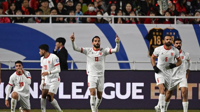 Jordans Mahmoud Al-Mardi (C) celebrates scoring his teams first goal during the FIFA 2026 World Cup Asian qualifier football match between South Korea and Jordan in Suwon on March 25, 2025. (Photo by Jung Yeon-je / AFP)