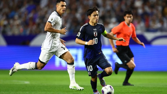 Soccer Football - World Cup - AFC Qualifiers - Group C - Japan v Indonesia - Suita City Stadium, Suita, Japan - June 10, 2025 Japan's Daichi Kamada scores their third goal REUTERS/Issei Kato