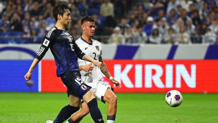 Soccer Football - World Cup - AFC Qualifiers - Group C - Japan v Indonesia - Suita City Stadium, Suita, Japan - June 10, 2025 Japans Daichi Kamada scores their third goal REUTERS/Issei Kato