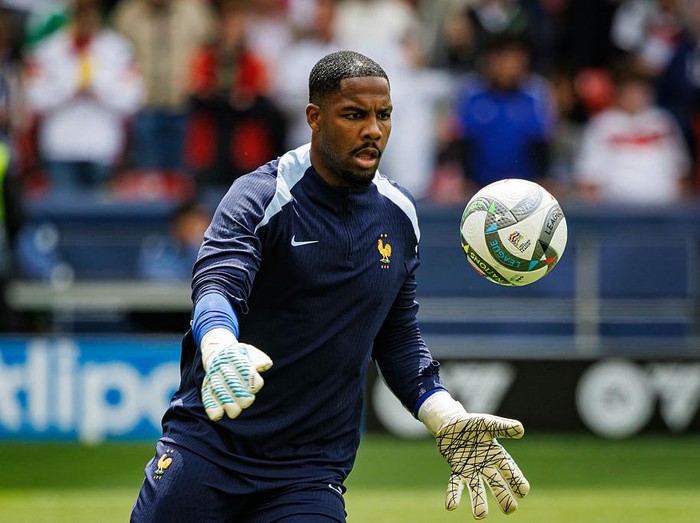 STUTTGART, GERMANY - JUNE 8: Goalkeeper Mike Maignan of France warming up prior to the UEFA Nations League 2025 third place match between Germany and France at Stuttgart Arena on June 8, 2025 in Stuttgart, Germany. (Photo by Sathire Kelpa/Eurasia Sport Images/Getty Images)