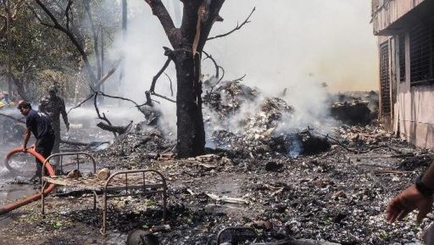 This handout taken and posted on the X (formerly Twitter) account of the Central Industrial Security Force (CISF) On June 12, 2025 shows the back of AN Air India plane after it crashed in a residential area near the airport in Ahmedabad. The London-bound Air India flight 171 passenger plane crashed on June 12 in India's western city of Ahmedabad with 242 on board, aviation officials said in what the airline called a 