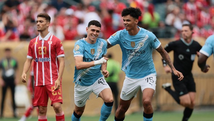 Man City vs Wydad Casablanca Soccer Football - FIFA Club World Cup - Group G - Manchester City v Wydad Casablanca - Lincoln Financial Field, Philadelphia, Pennsylvania, U.S. - June 18, 2025 Manchester Citys Phil Foden celebrates scoring their first goal with Nico OReilly IMAGN IMAGES via Reuters/Caean Couto
