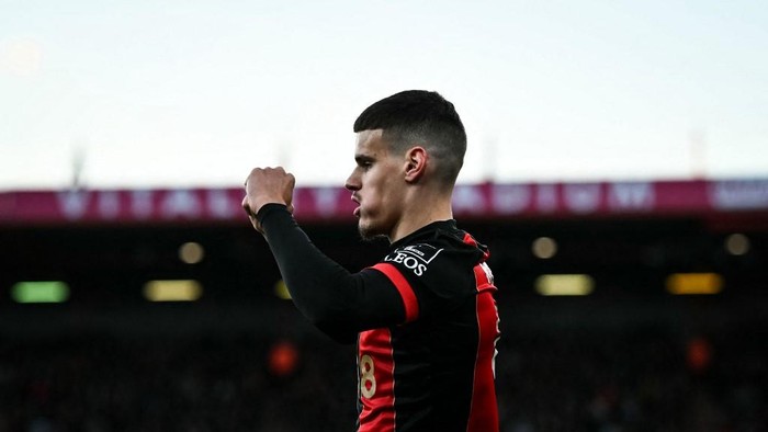 Bournemouths Hungarian defender #03 Milos Kerkez celebrates the own goal scored by Brentfords German midfielder #27 Vitaly Janelt during the English Premier League football match between Bournemouth and Brentford at the Vitality Stadium in Bournemouth, southern England on March 15, 2025. (Photo by Ben STANSALL / AFP) / RESTRICTED TO EDITORIAL USE. No use with unauthorized audio, video, data, fixture lists, club/league logos or live services. Online in-match use limited to 120 images. An additional 40 images may be used in extra time. No video emulation. Social media in-match use limited to 120 images. An additional 40 images may be used in extra time. No use in betting publications, games or single club/league/player publications. /