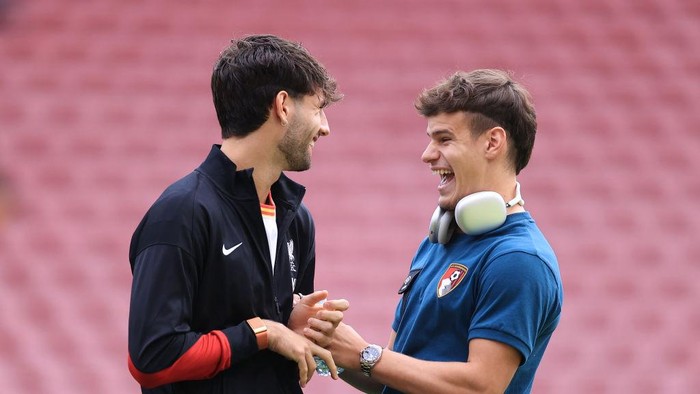LIVERPOOL, ENGLAND - SEPTEMBER 21: Dominik Szoboszlai of Liverpool talks to Milos Kerkez of Bournemouth before the Premier League match between Liverpool FC and AFC Bournemouth at Anfield on September 21, 2024 in Liverpool, England. (Photo by Simon Stacpoole/Offside/Offside via Getty Images)