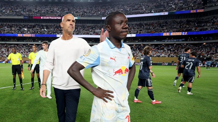 PHILADELPHIA, PENNSYLVANIA - JUNE 26: Thomas Letsch, Head Coach of FC Salzburg, and Edmund Baidoo #20 of FC Salzburg look dejected following the FIFA Club World Cup 2025 group H match between FC Red Bull Salzburg and Real Madrid CF at Lincoln Financial Field on June 26, 2025 in Philadelphia, Pennsylvania. (Photo by Emilee Chinn - FIFA/FIFA via Getty Images)