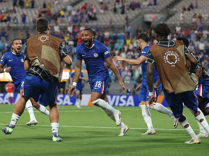 CHARLOTTE, NORTH CAROLINA - JUNE 28: Christopher Nkunku #18 of Chelsea FC celebrates scoring his team's second goal during the FIFA Club World Cup 2025 round of 16 match between SL Benfica and Chelsea FC at Bank of America Stadium on June 28, 2025 in Charlotte, North Carolina. (Photo by Steph Chambers - FIFA/FIFA via Getty Images)