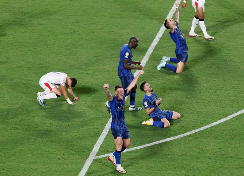 Soccer Football - FIFA Club World Cup - Round of 16 - Manchester City v Al Hilal - Camping World Stadium, Orlando, Florida, U.S. - June 30, 2025 Al Hilal's Sergej Milinkovic-Savic celebrates with teammates after the match REUTERS/Hannah Mckay