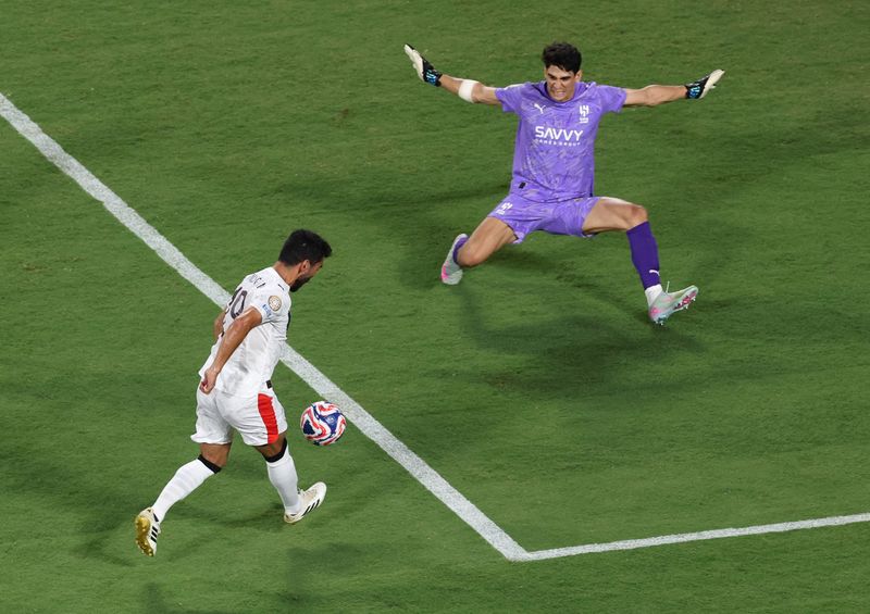 Soccer Football - FIFA Club World Cup - Round of 16 - Manchester City v Al Hilal - Camping World Stadium, Orlando, Florida, U.S. - June 30, 2025 Manchester City's Savinho in action with Al Hilal's Yassine Bounou REUTERS/Hannah Mckay