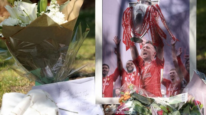 A picture of Liverpools Portuguese soccer player Diogo Jota stands next to flower tributes, after Jota died in a car crash near Zamora, Spain, outside Anfield Stadium in Liverpool, Britain, July 3, 2025. REUTERS/Temilade Adelaja