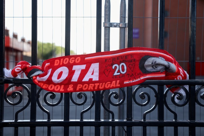 A scarf is tied to the Shankly Gates outside Anfield Stadium in tribute to Liverpools Portuguese soccer player Diogo Jota, who died in a car crash near Zamora, Spain, in Liverpool, Britain, July 3, 2025. REUTERS/Temilade Adelaja