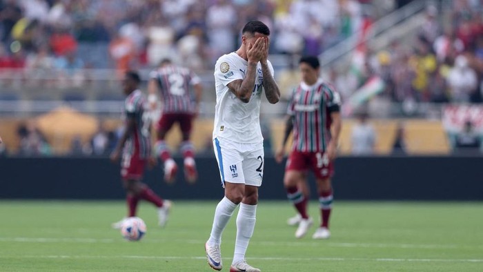 ORLANDO, FLORIDA - JULY 04: Joao Cancelo #20 of Al Hilal reacts following a moments silence in memory of former football player Diogo Jota and his brother Andre Silva, who passed away on the 3rd of July 2025 prior to the FIFA Club World Cup 2025 quarter final match between Fluminense FC and Al Hilal at Camping World Stadium on July 04, 2025 in Orlando, Florida.   Megan Briggs/Getty Images/AFP (Photo by Megan Briggs / GETTY IMAGES NORTH AMERICA / Getty Images via AFP)