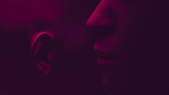 Someone is speaking into someones ear. Topics of negotiations, collusion, communication