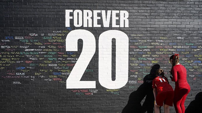Fans sign a mural in memory of Liverpool player Diogo Jota, on Sybil Road near Anfield. The club, as well as fans and football as a whole, are in mourning after the 28-year-old Portugal Diogo Jota his brother Andre Silva were killed in a car crash in Spain on Thursday 3rd July. Picture date: Tuesday July 8, 2025. (Photo by Peter Byrne/PA Images via Getty Images)